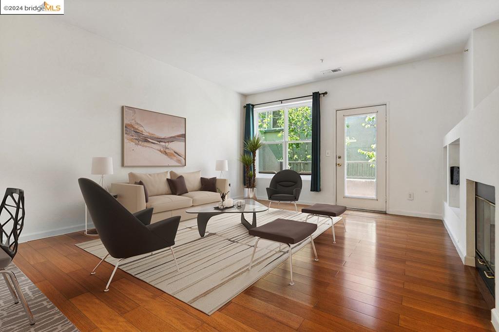 a living room with furniture window and wooden floor