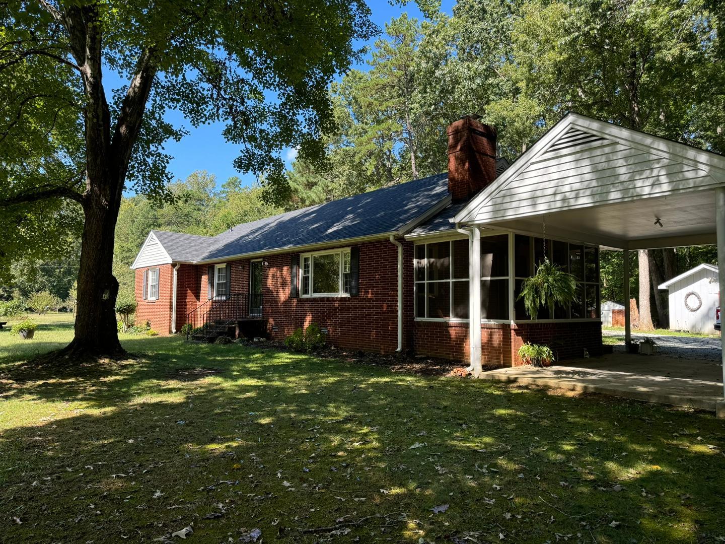 a front view of a house with a yard table and chairs