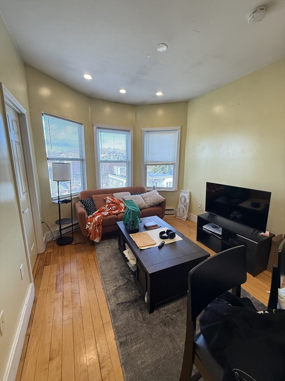 a living room with furniture and a rug