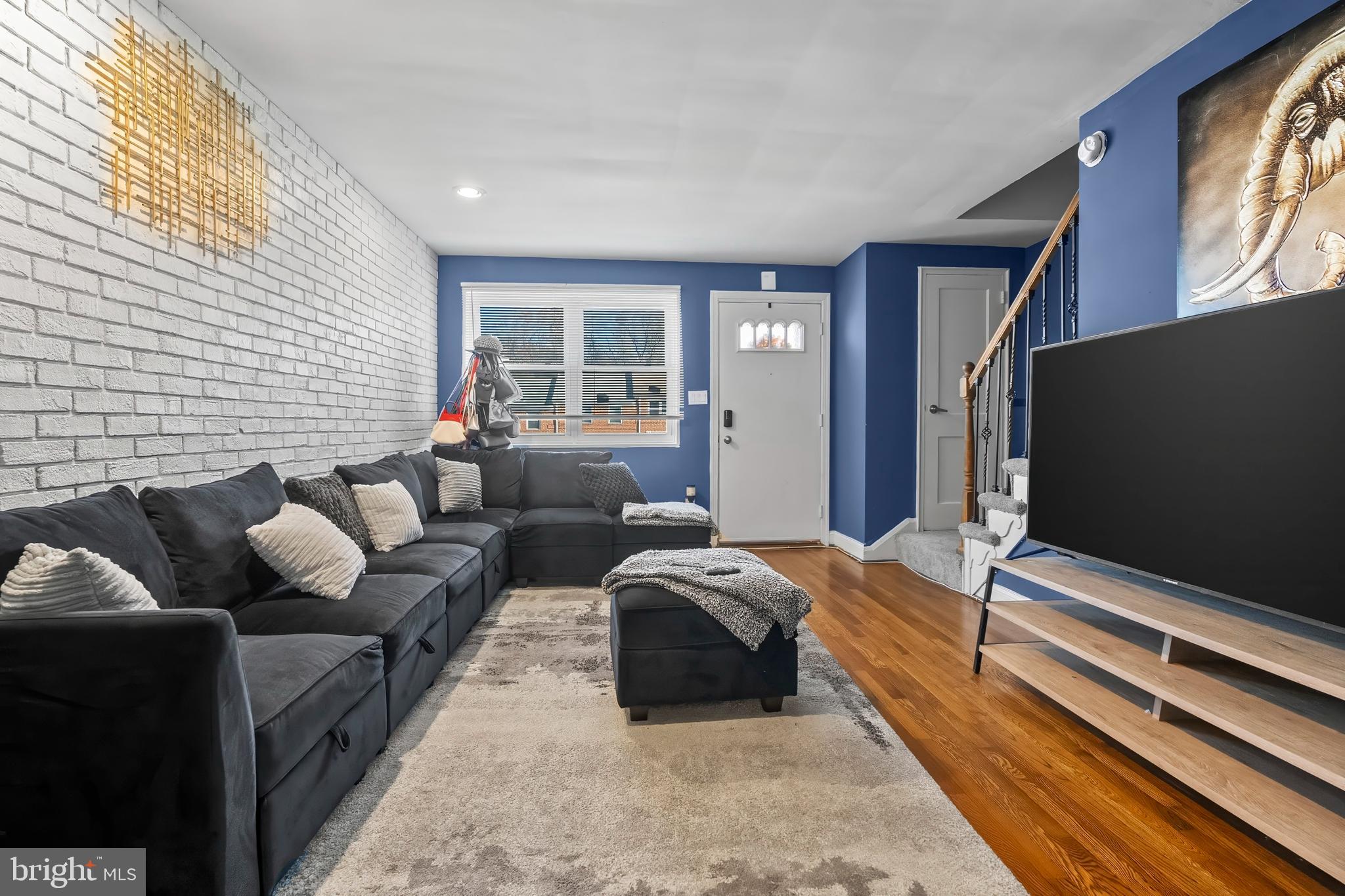 a bedroom with furniture and a flat screen tv