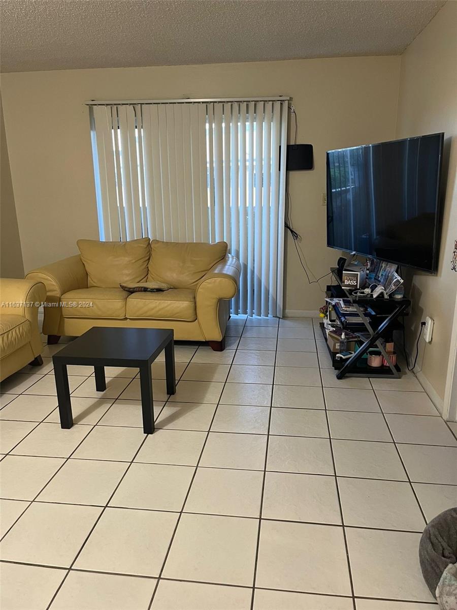 a living room with a black white checkered floor