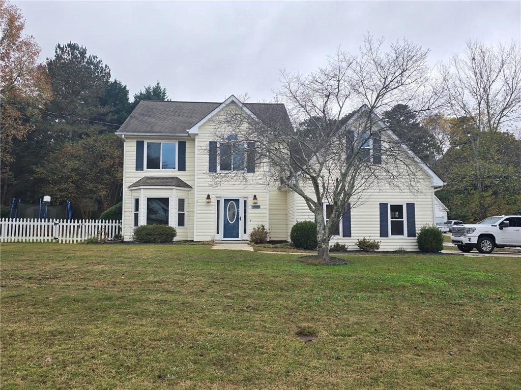 a front view of a house with a yard