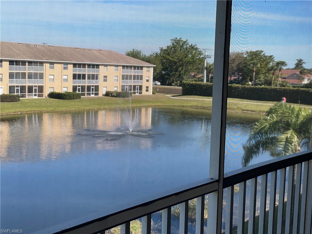 a view of a lake with a house in the background