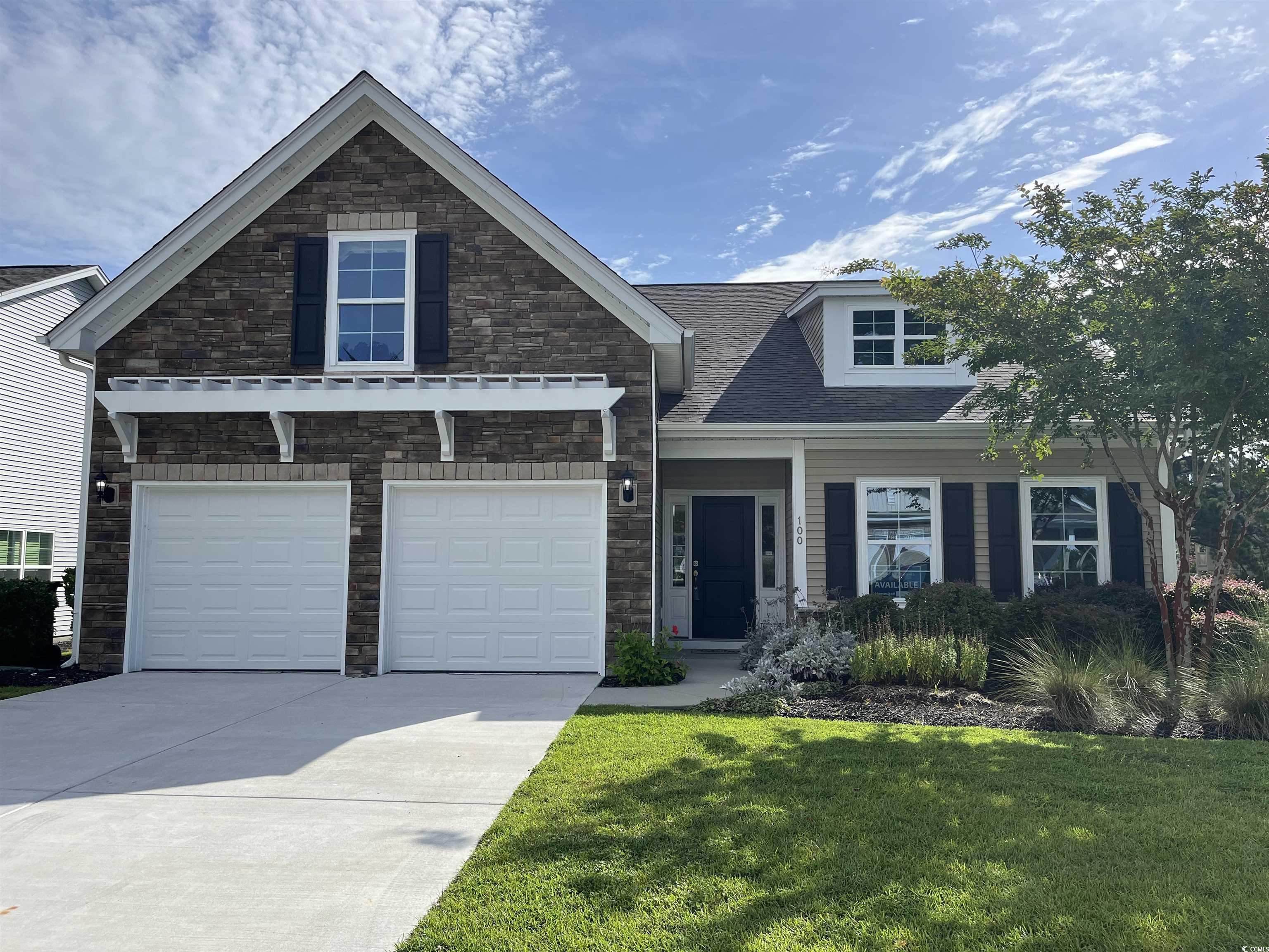 Craftsman-style home featuring a garage and a fron