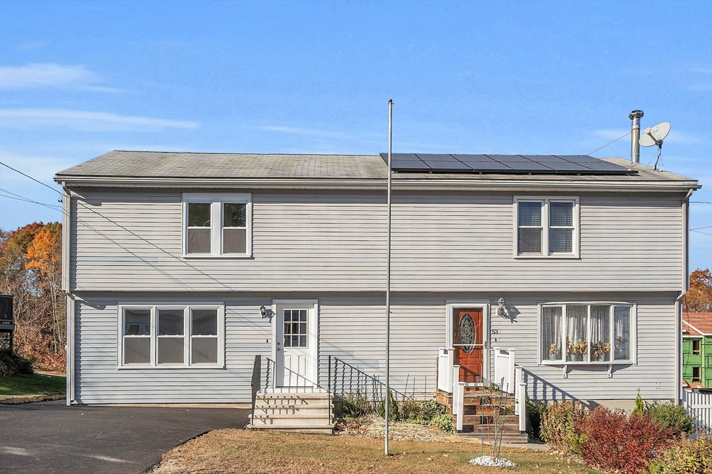 a front view of a house with garage