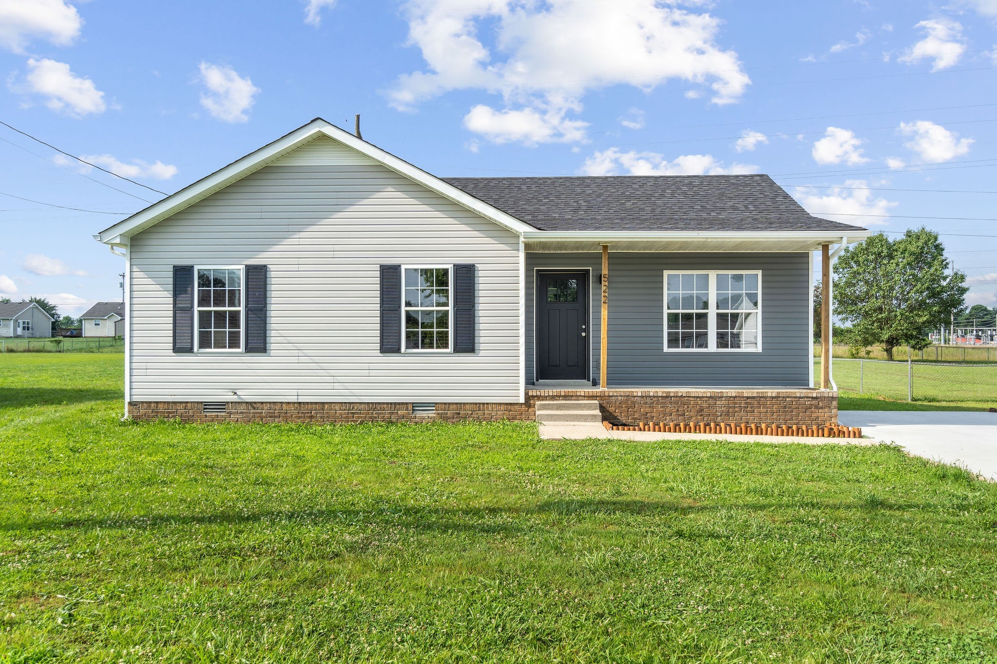 a front view of a house with a yard