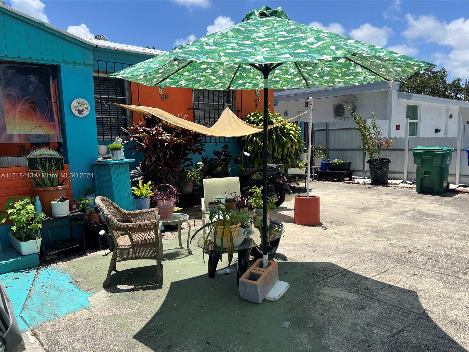 a view of a chairs and tables in patio