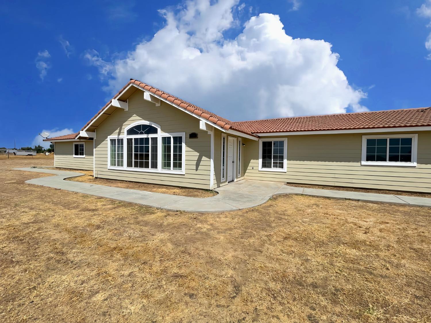 a house with trees in the background