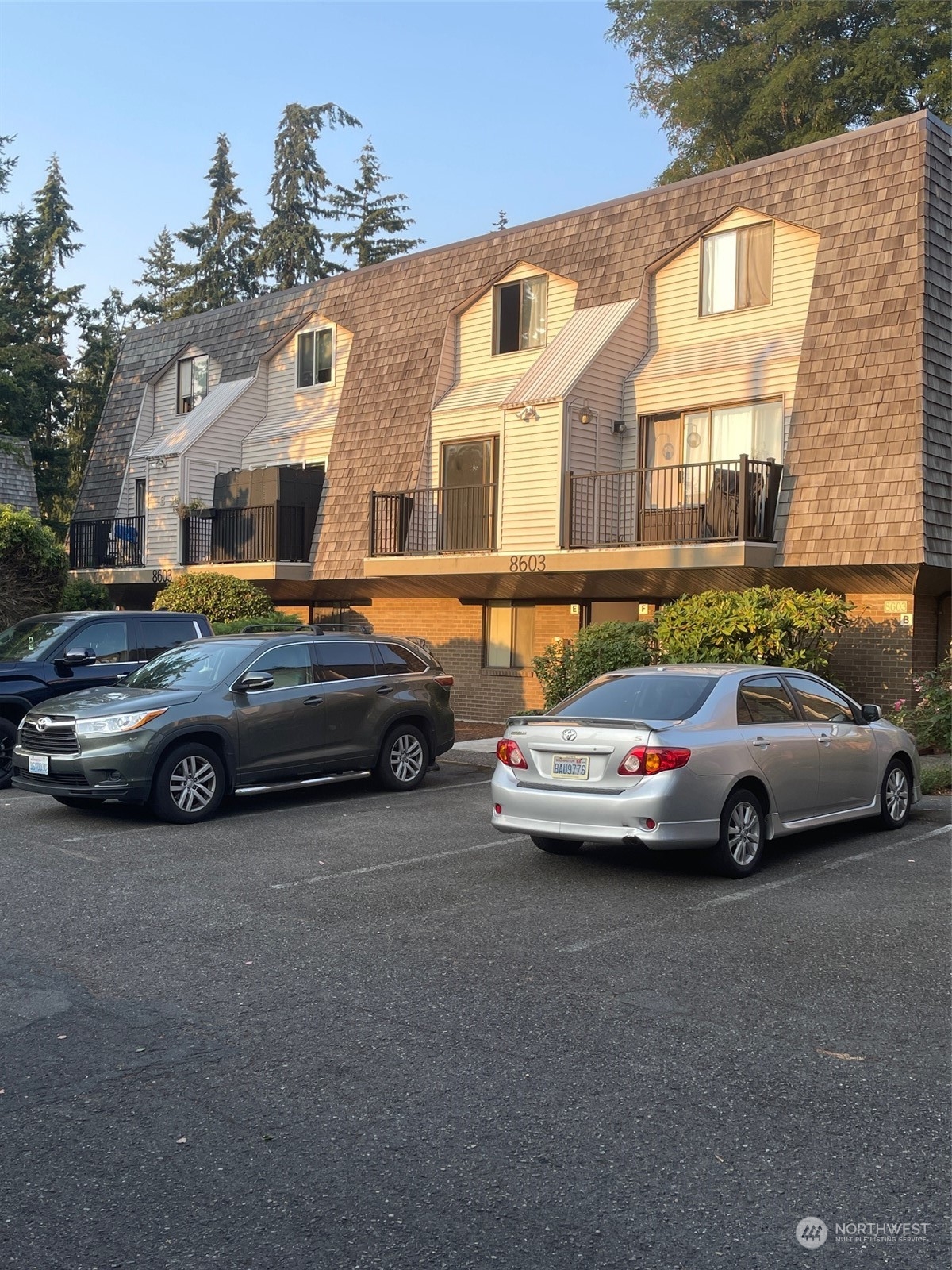 a view of a cars parked in front of a house