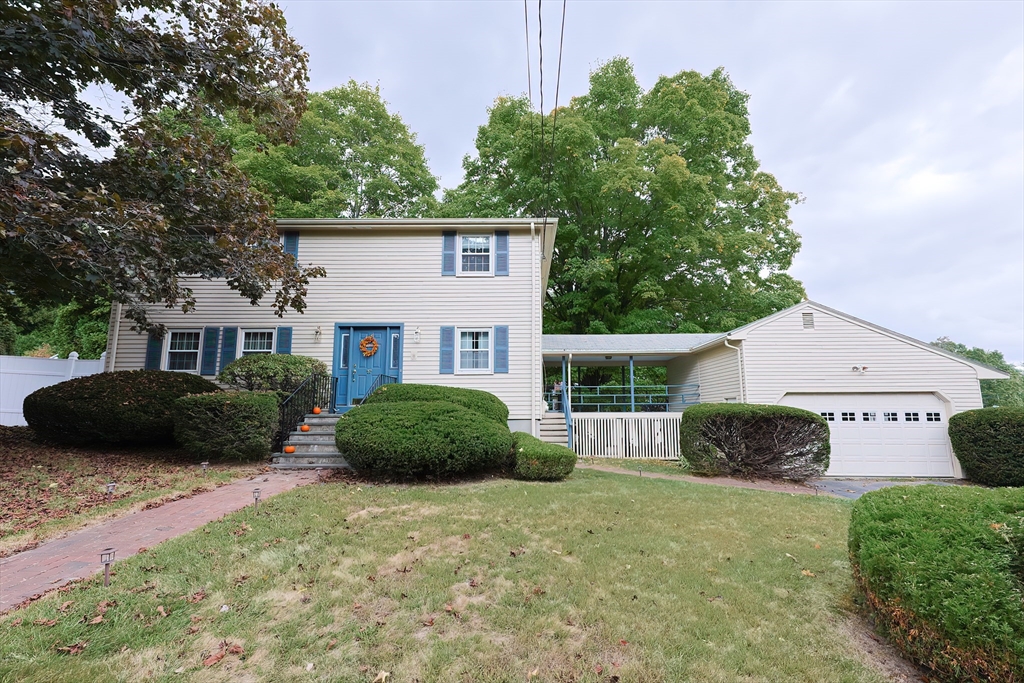 a view of a front of a house with a yard