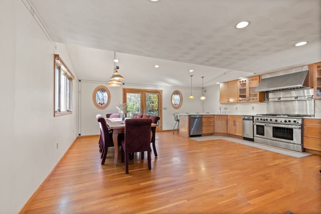 a view of a kitchen with dining table and chairs