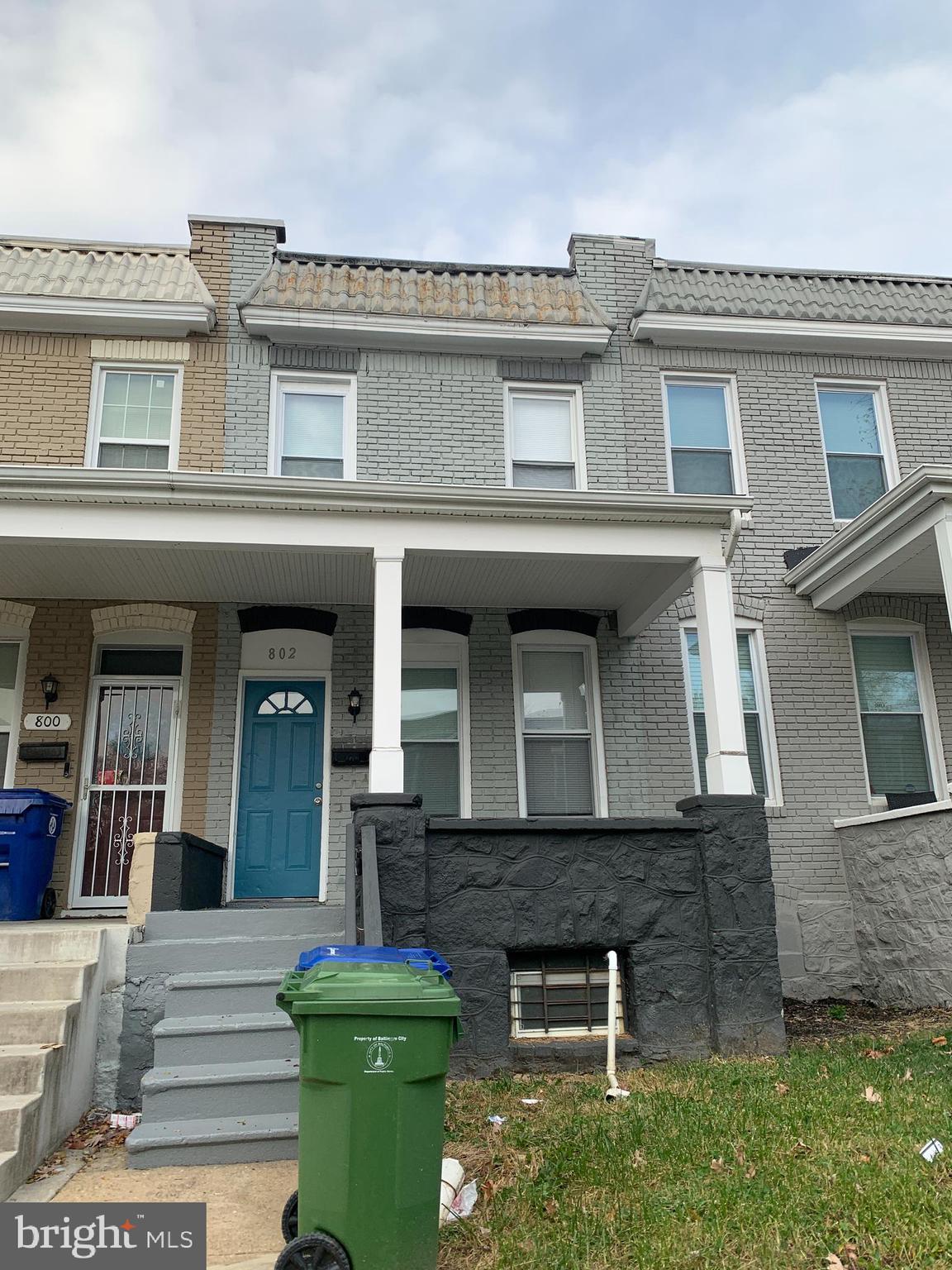 front view of a house with a small yard