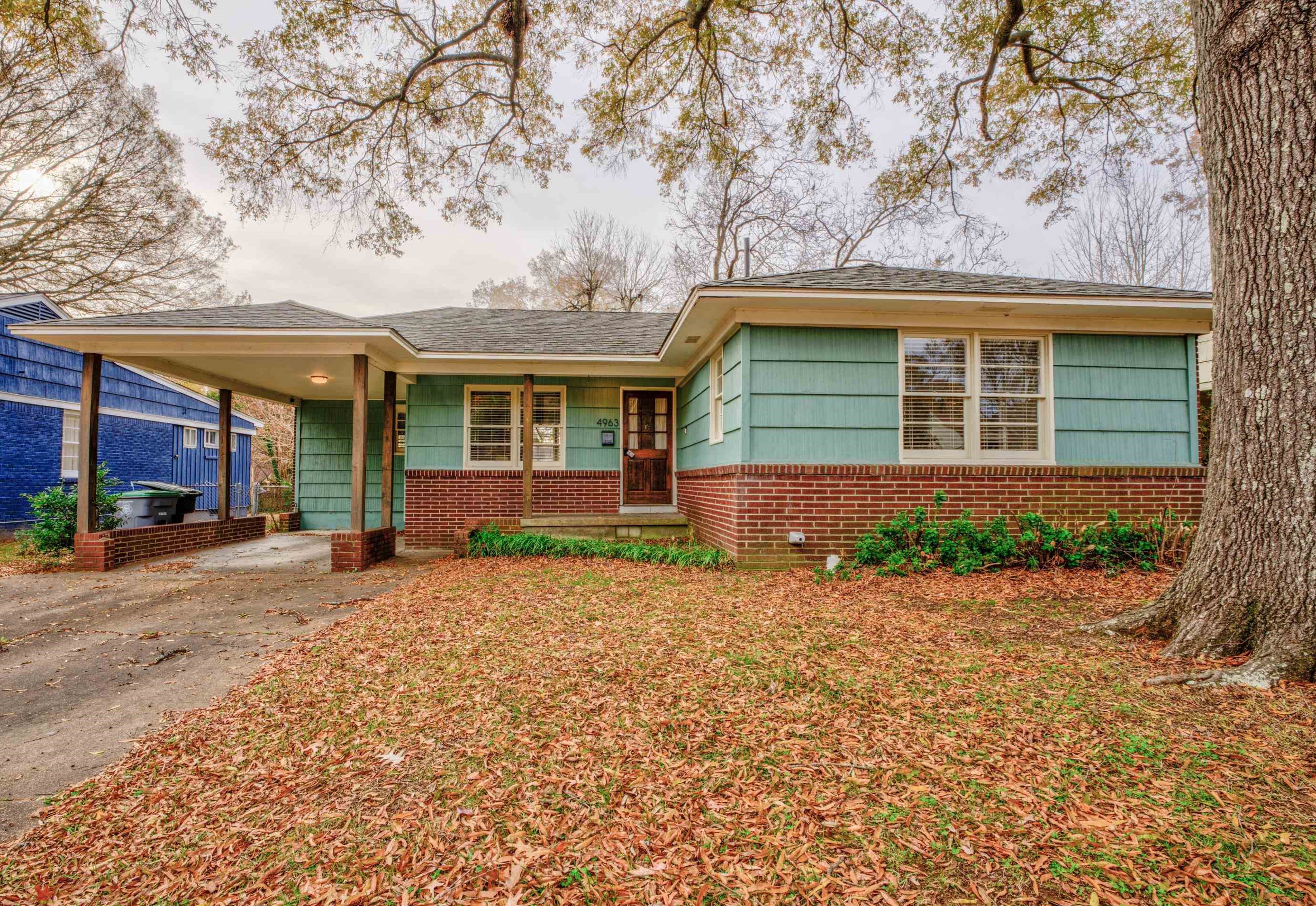 front view of a house with a yard