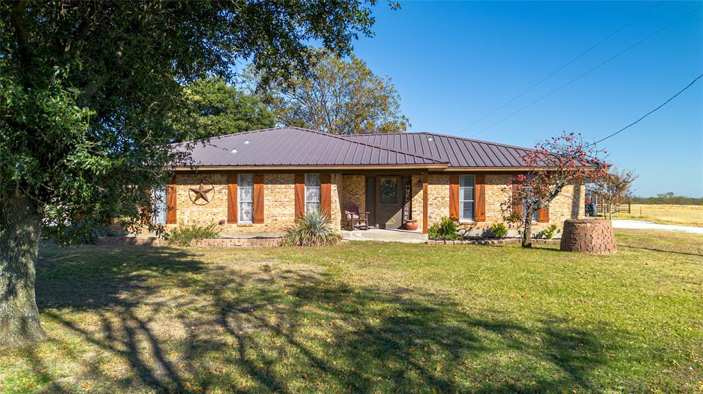 a front view of a house with swimming pool