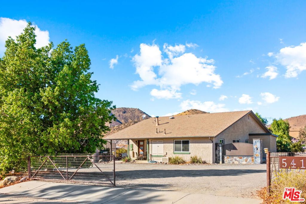 a view of a house with a street