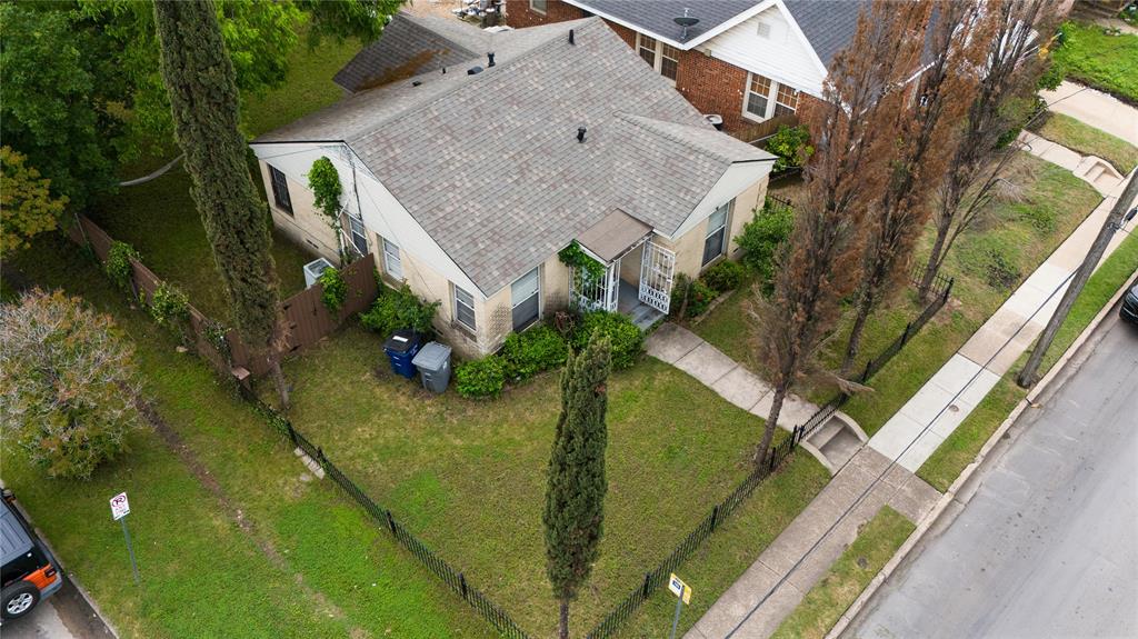 a aerial view of a house with a yard