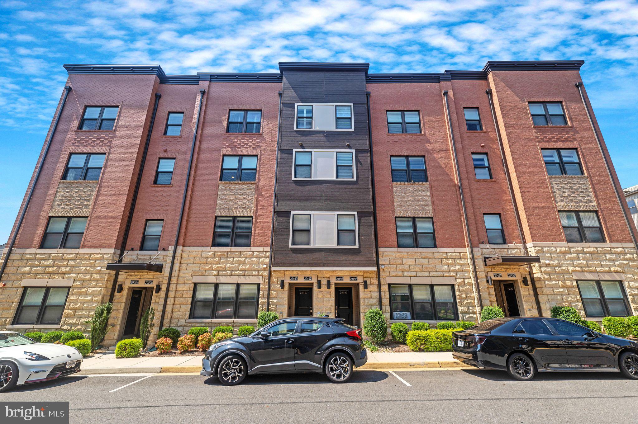 a car parked in front of a brick building