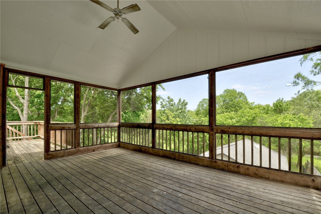 a view of a balcony with wooden floor