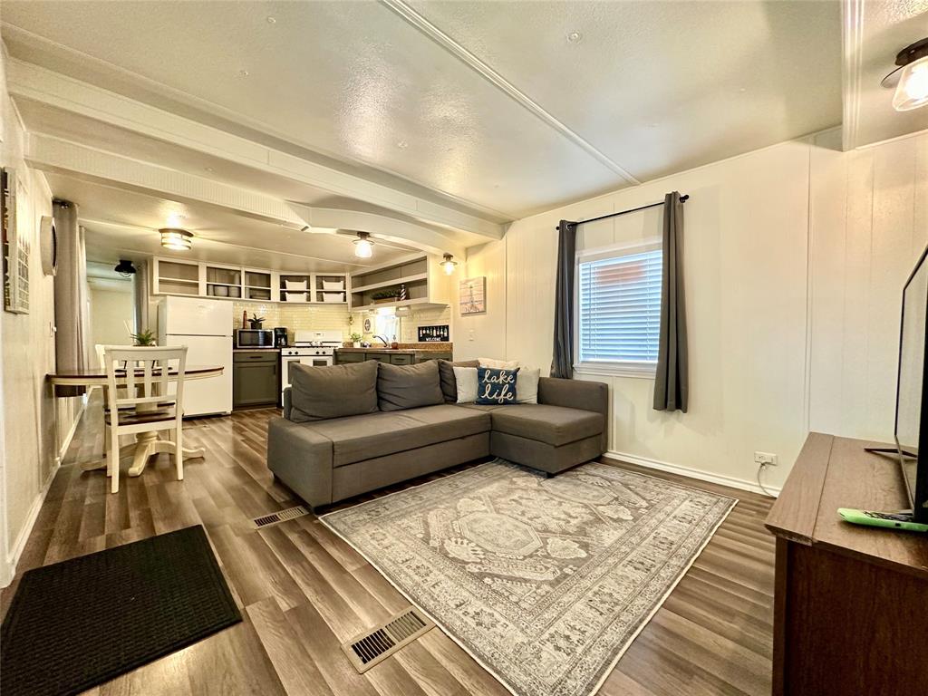 a living room with furniture and a rug