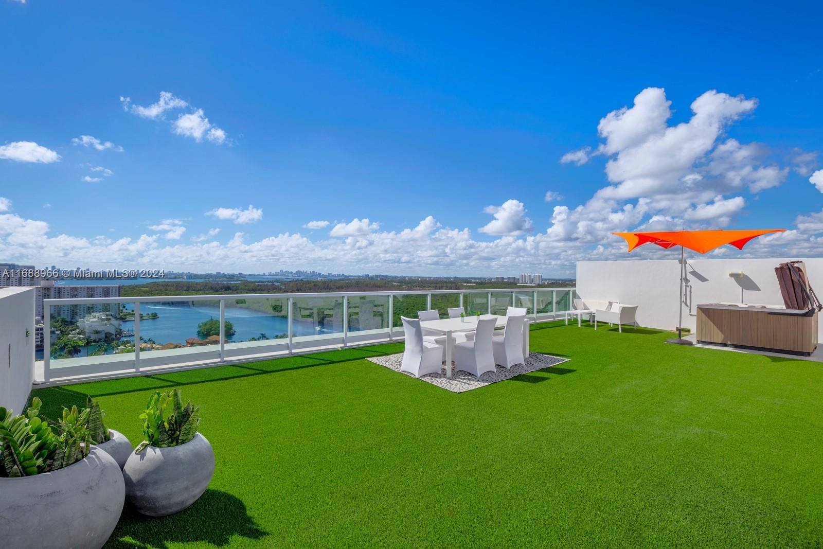 a view of a house with a backyard porch and sitting area