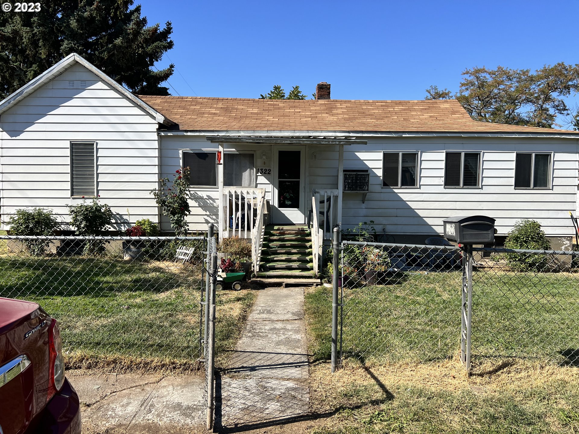 a front view of a house with garden