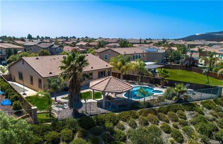 an aerial view of a house with a garden