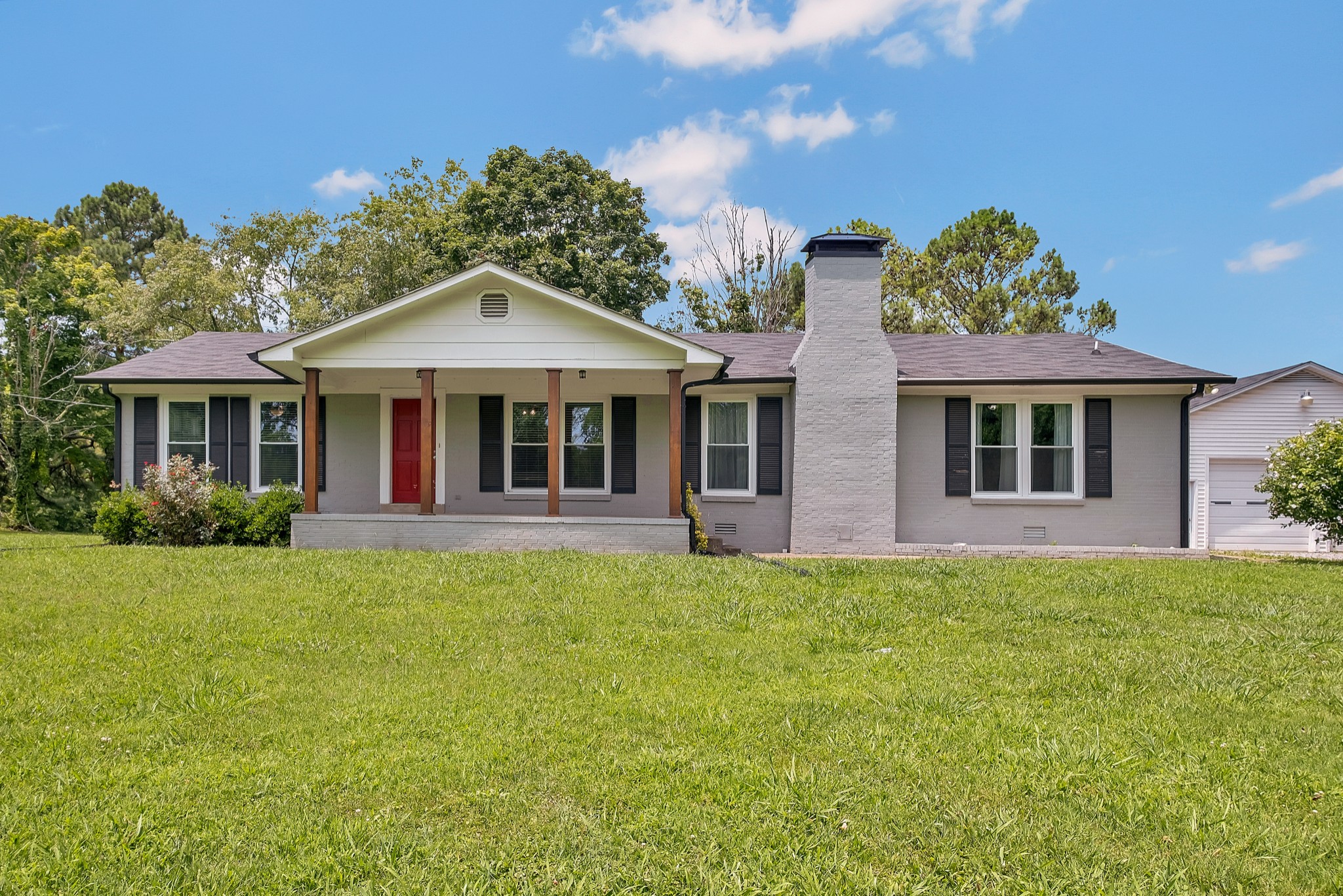 a front view of a house with a yard