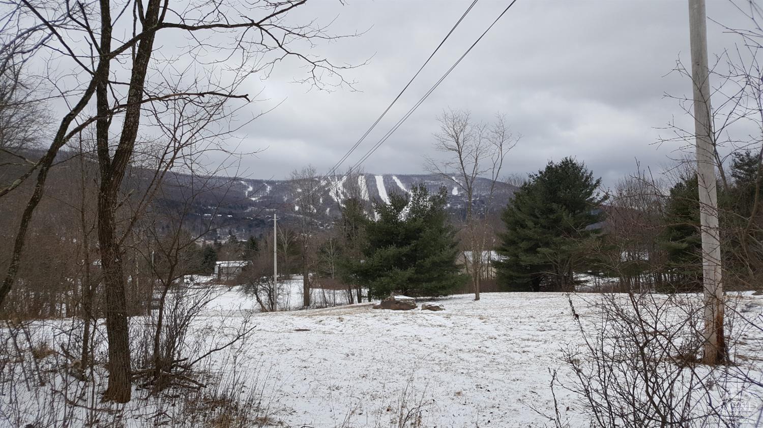 a view of snow on the road