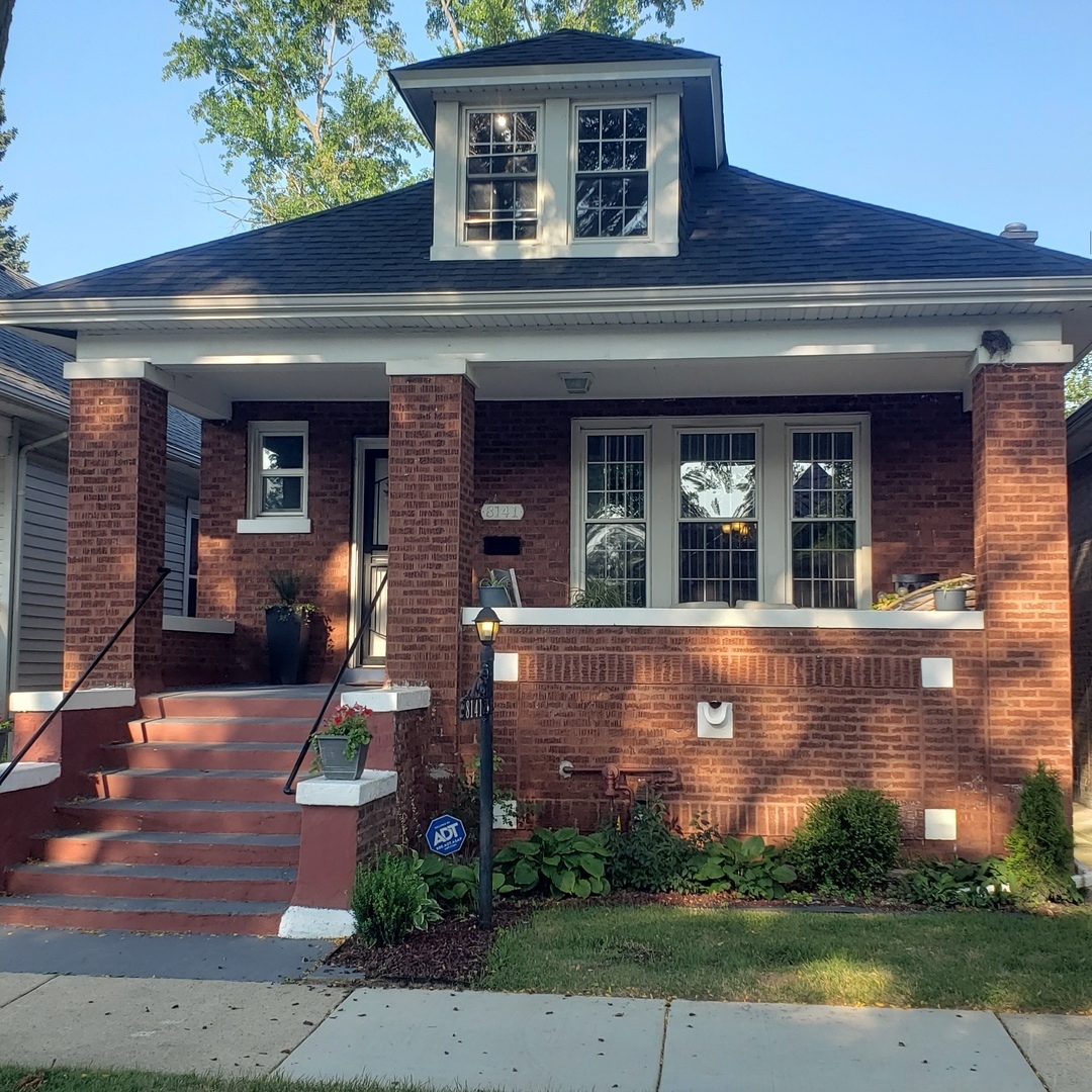 front view of house with a yard