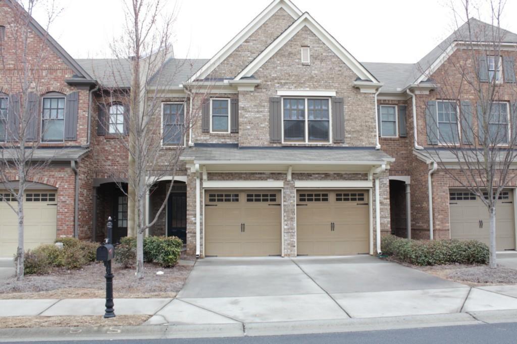 a front view of a house with a garage