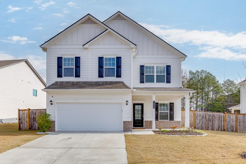 a front view of a house with a garage