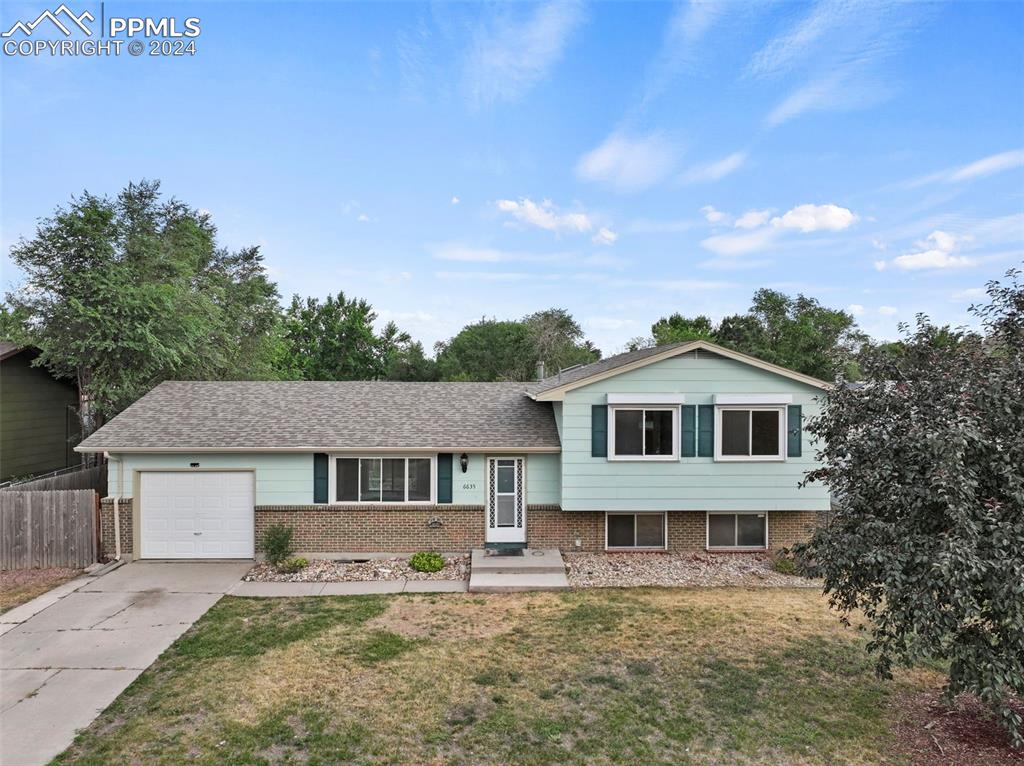 front view of a house with a yard