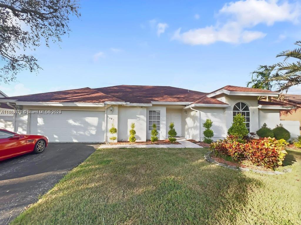 a front view of a house with a yard