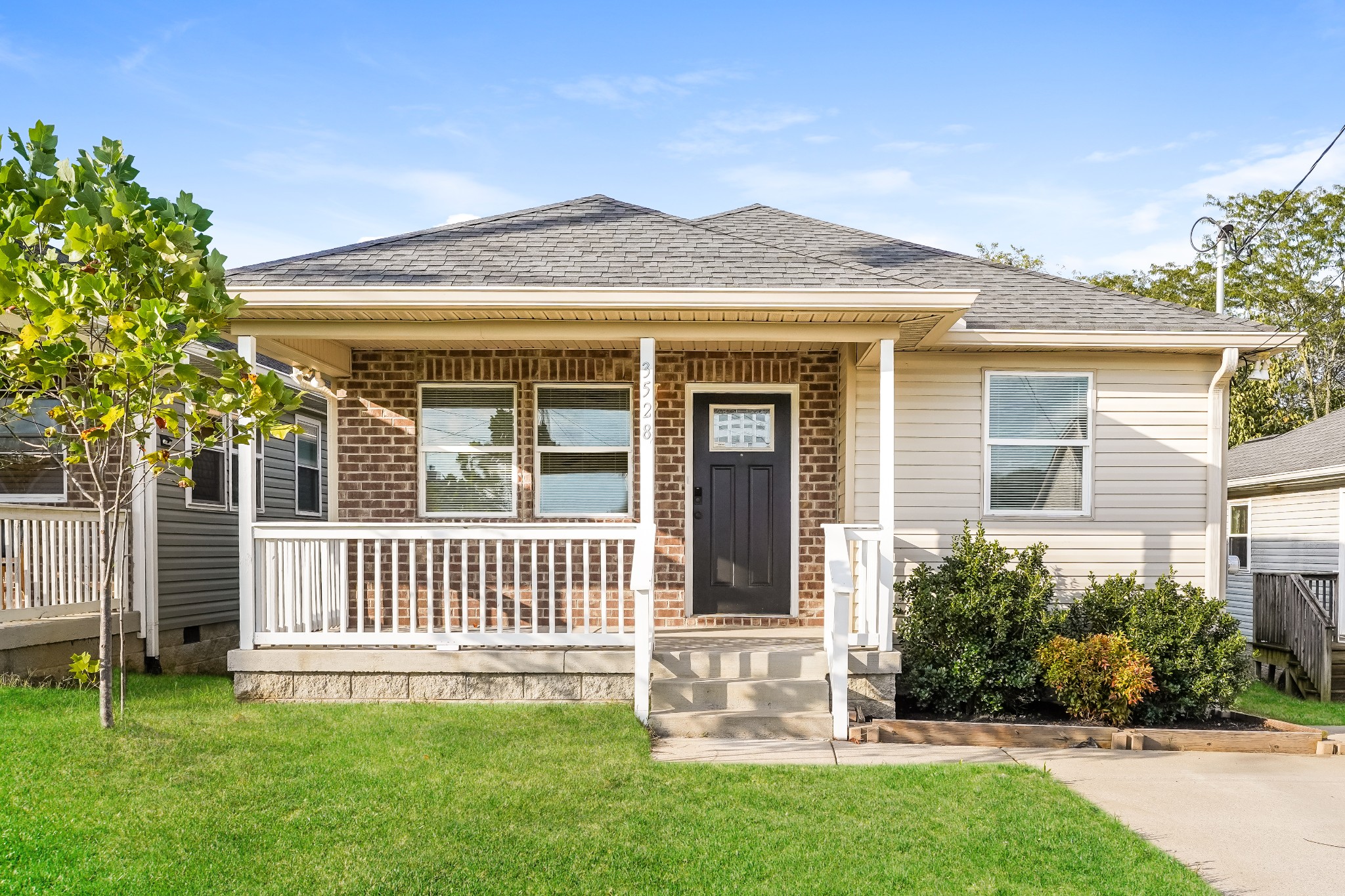 front view of a house with a yard