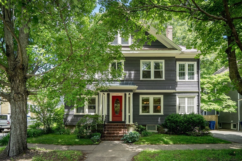 front view of a house with a yard