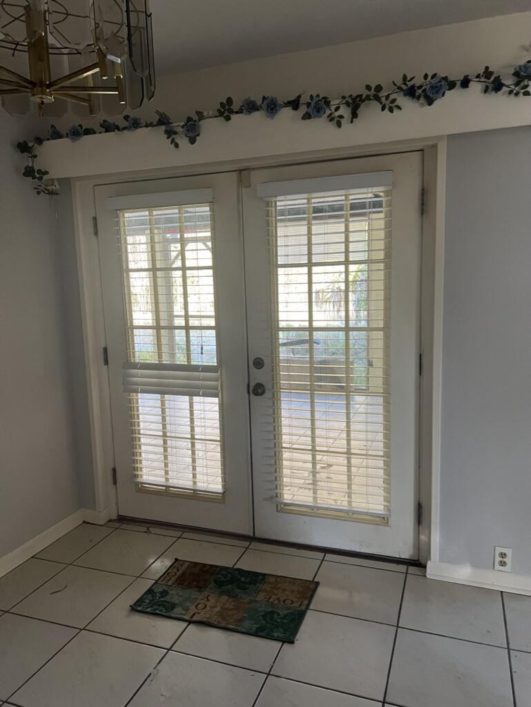 a view of an empty room and a window