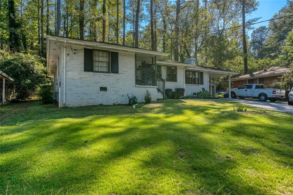 a view of a house with a big yard