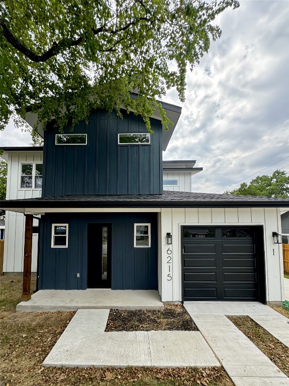 a front view of a house with garage