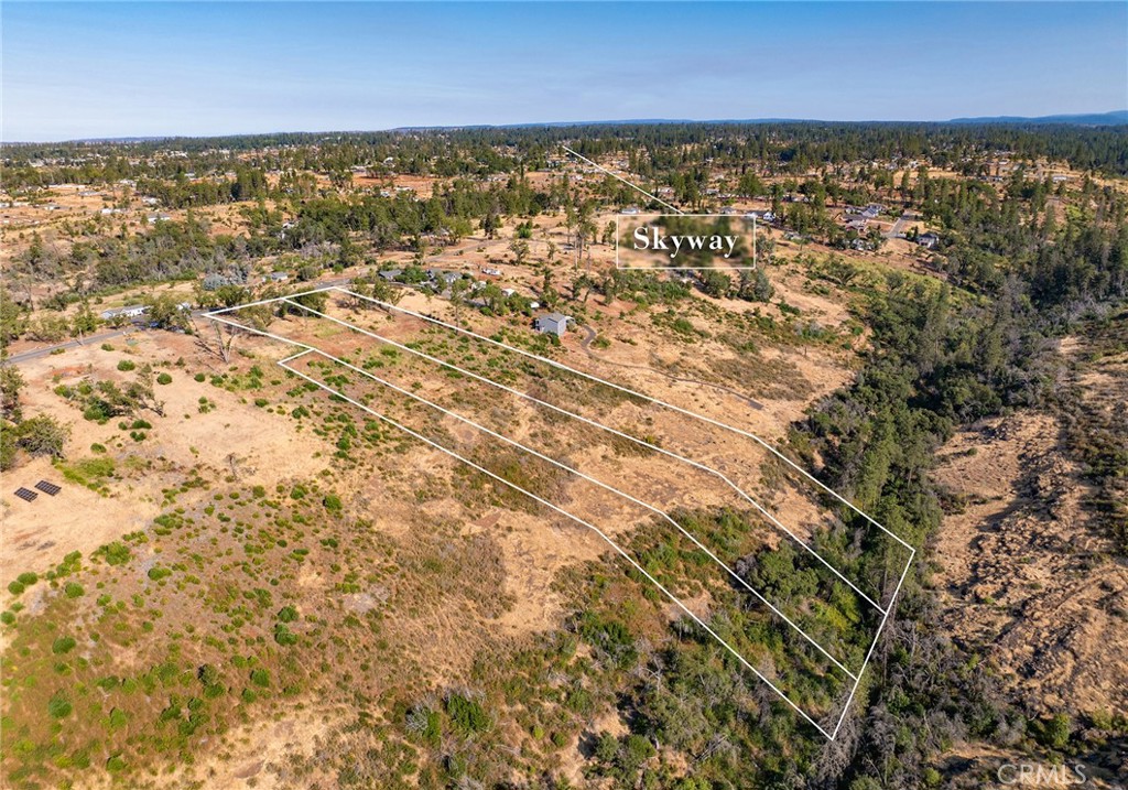 an aerial view of residential building and ocean