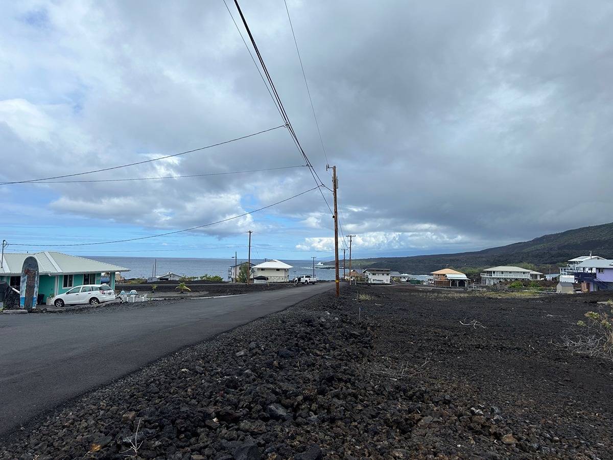 a view of a road with fire pit