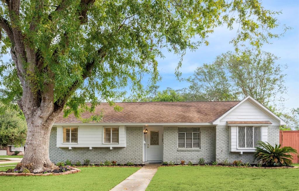 a front view of a house with yard