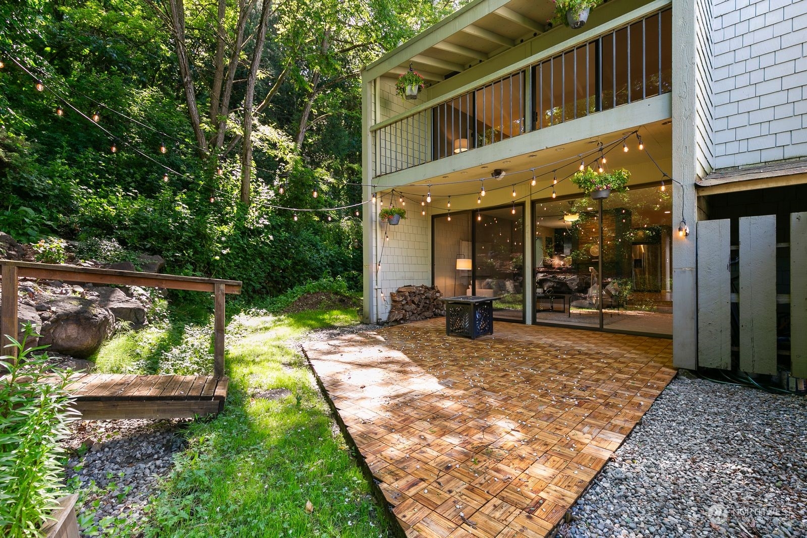 a view of a house with backyard sitting area and garden