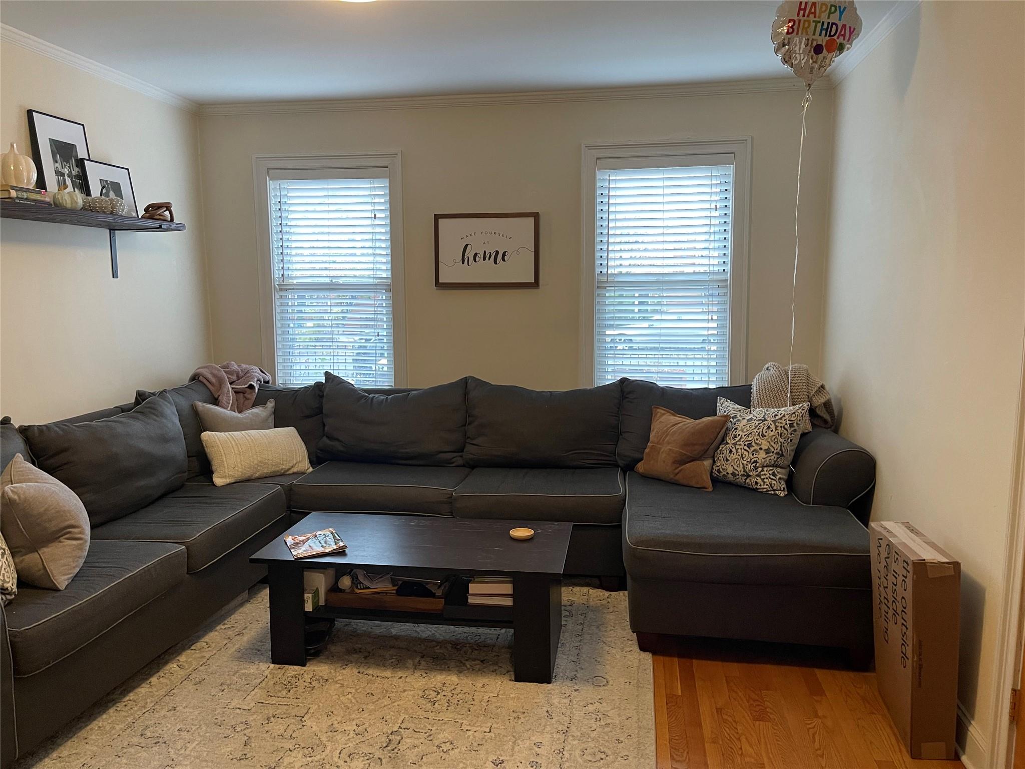 a living room with furniture and a window