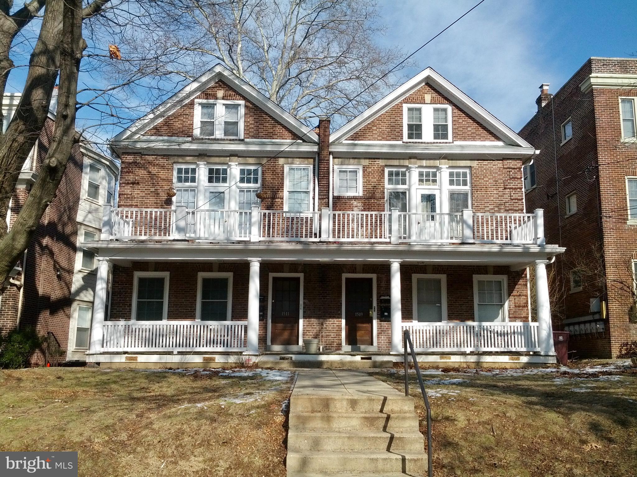 front view of a building with a yard