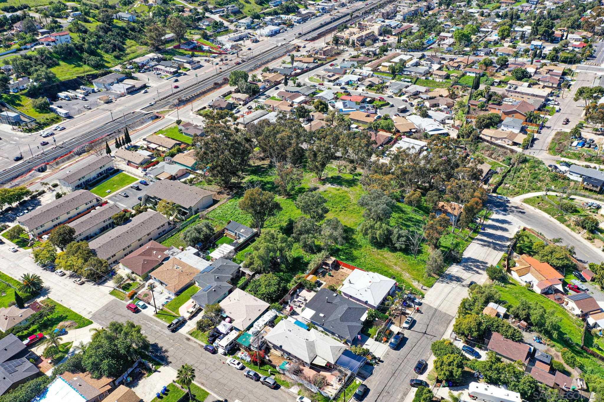 an aerial view of residential houses with outdoor space