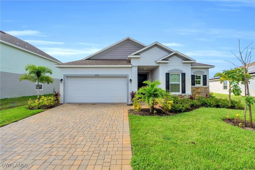 a front view of house with yard and green space