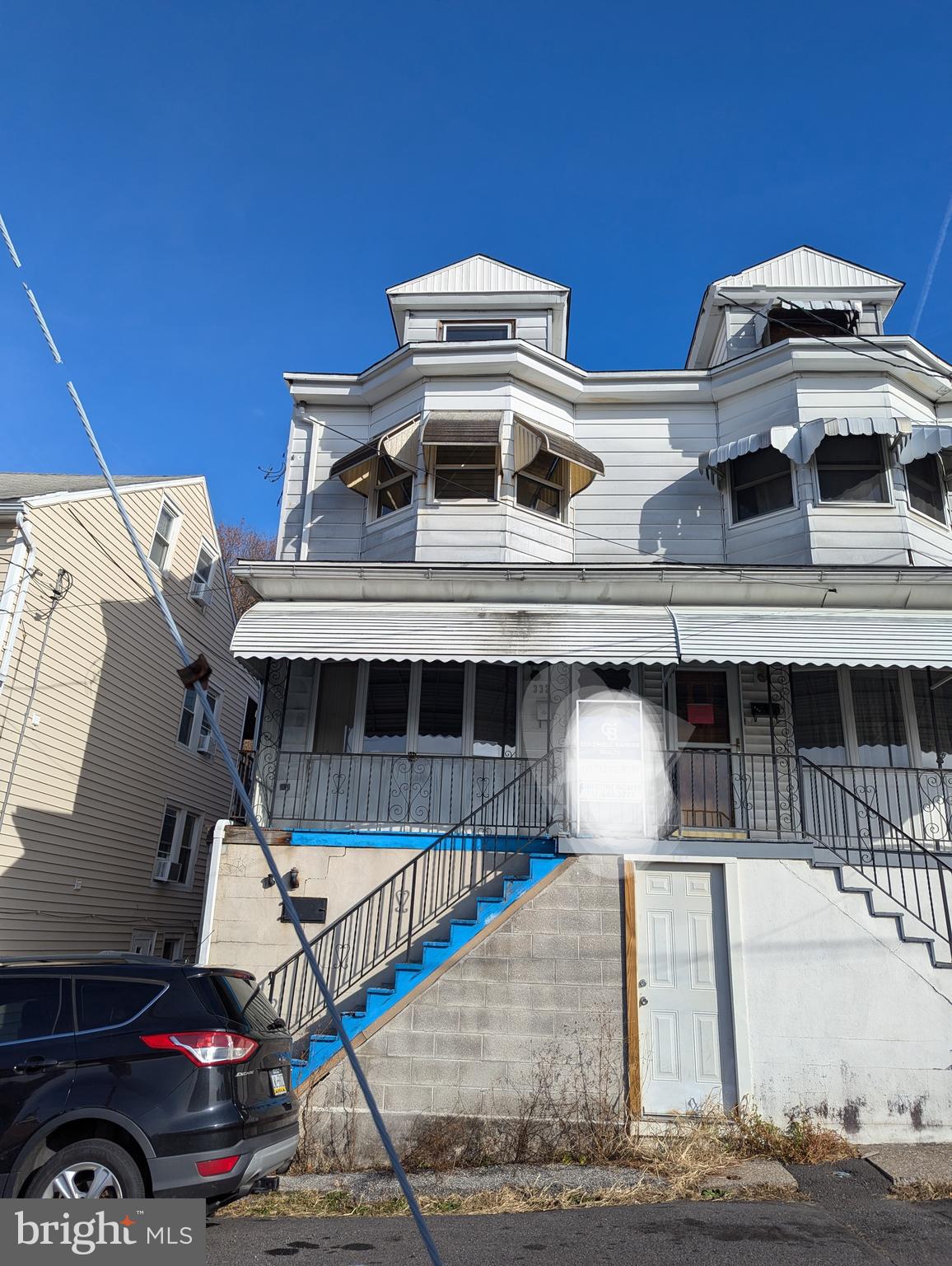 a front view of a house with parking space