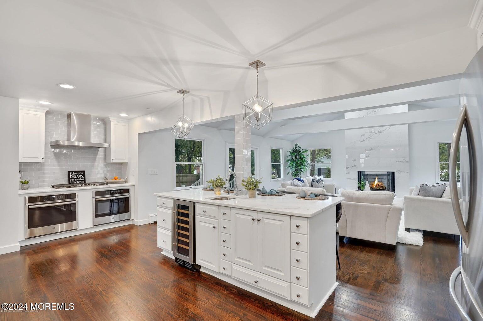 a kitchen with a stove top oven sink and cabinets