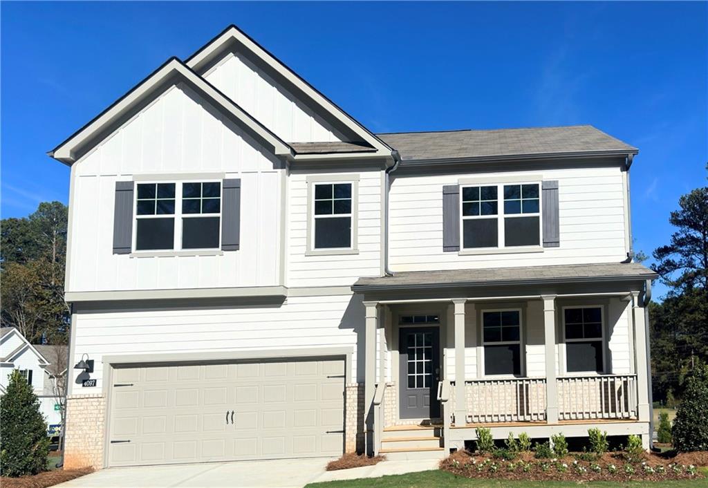 a front view of a house with garage