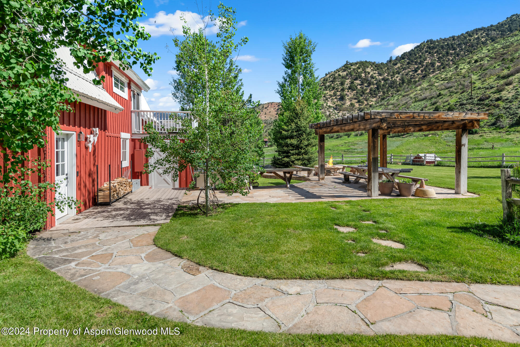 a view of a backyard with a patio